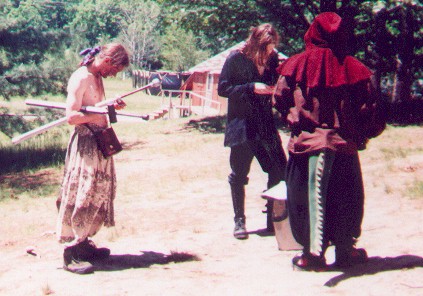 A trio attempting rituals behind Conundrum's cabin.