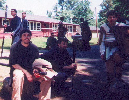 Adventurers. Sitting. Standing. Milling about.